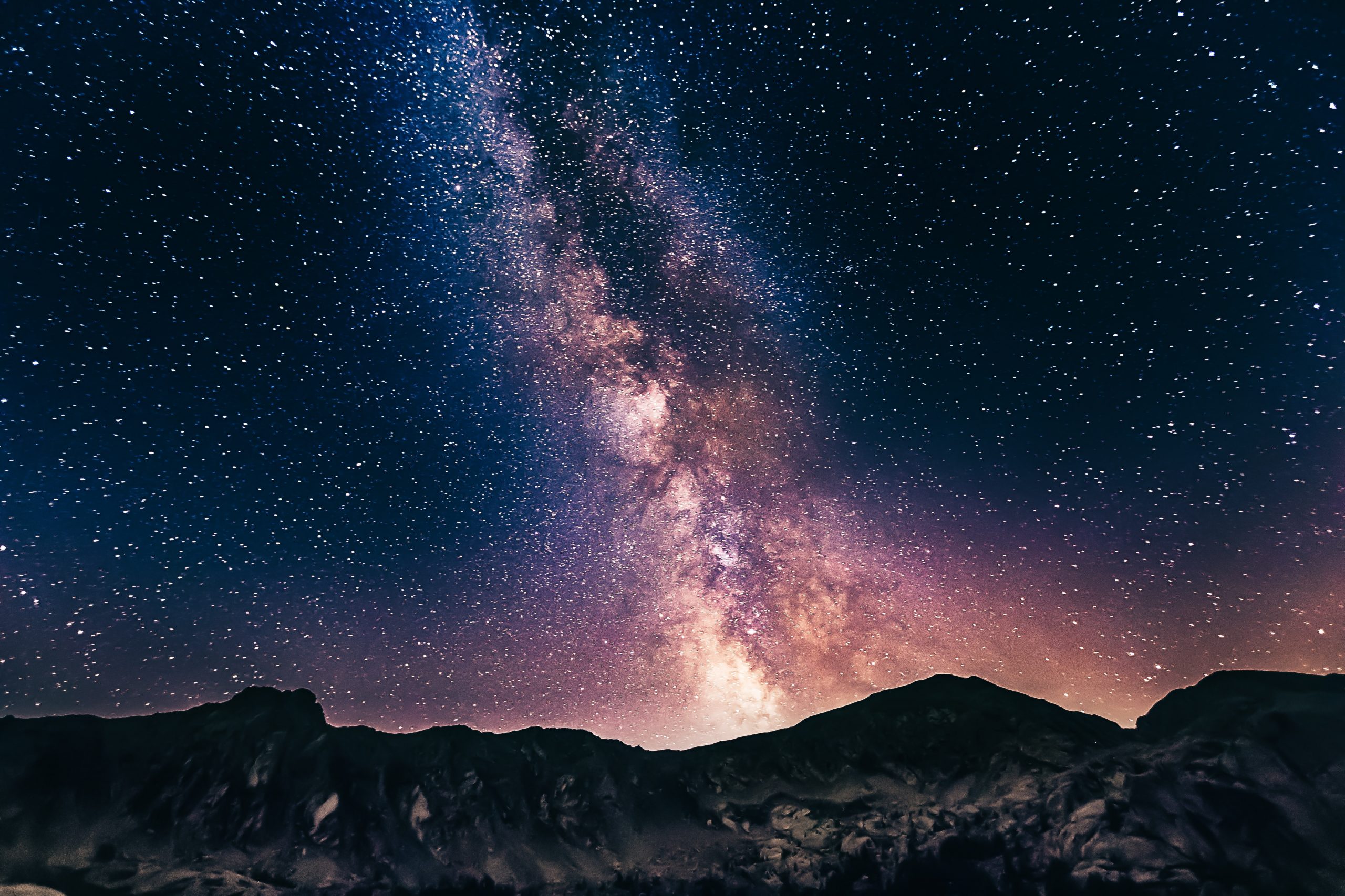 night sky with stars and mountains