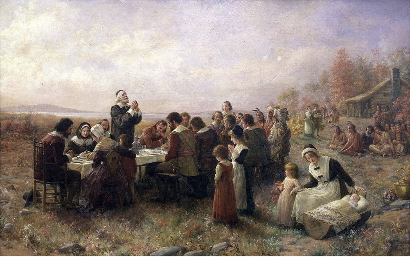 A Pilgrim man stands thanking God at their first Thanksgiving dinner