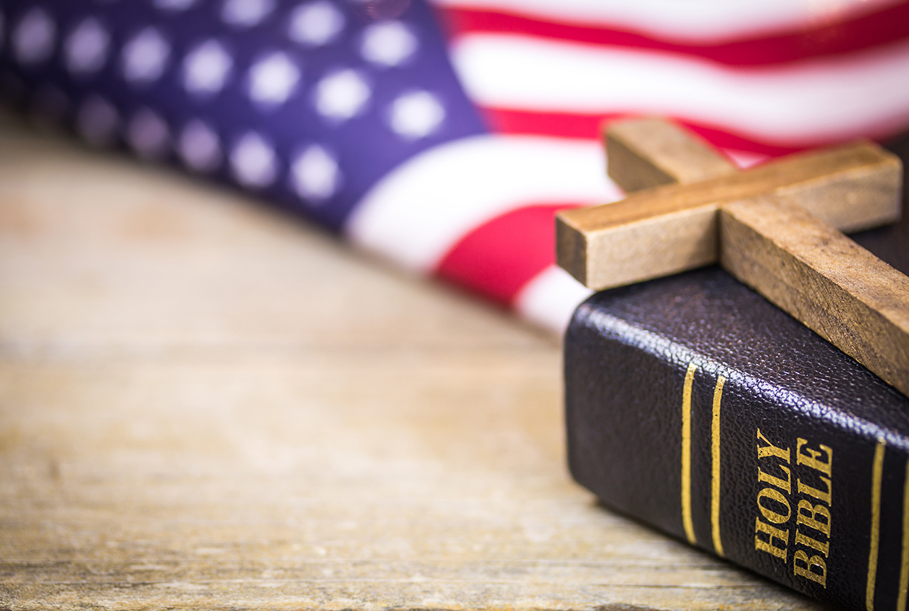 American flag, cross, and Bible